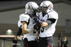 Aaron Fuller and Chochy Luce celebrate after a Lovejoy touchdown.