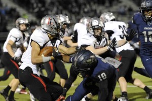 Aaron Fuller tries to escape the Wylie East kickoff team.