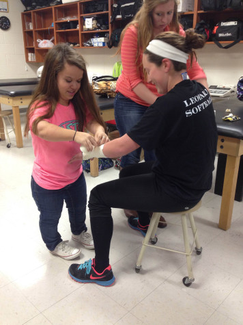 Junior Hannah Ayers is an athletic trainer for the football and softball teams.  