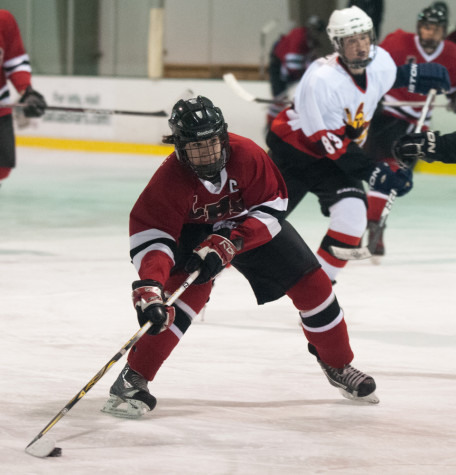 Senior Sky Chambers takes the puck down the ice.