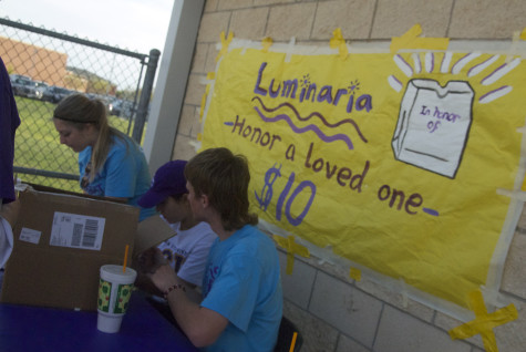 Senior Cody McLemore, and Juniors Madi Franquiz and Logan Stallings, sell luminaria at Relay for Life on Friday, April 11, 2014.