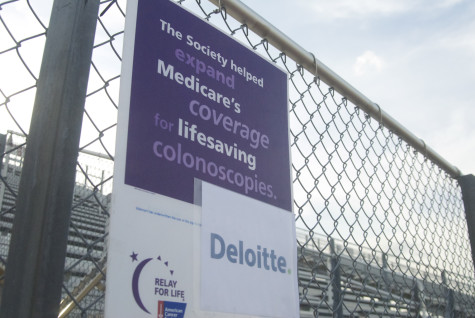 Signs lined the track to provide information about Cancer and to promote local businesses on Friday, April 11, 2014.