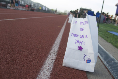 Luminaria lines the track prior to the opening ceremony on Friday, April 11, 2014.