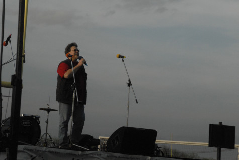 Math teacher, Andrew Stallings, speaks at the Opening Ceremony about his battle with cancer on Friday, April 11, 2014.