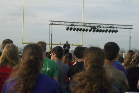 Students listen to Fairview Mayor, Darion Culbertson, speak at Relay for Life on Friday, April 11, 2014.