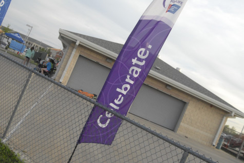 Signs show the purposes of Relay for Life on Friday, April 11, 2014.