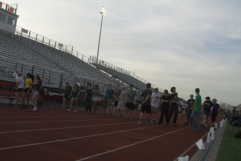 Students take their first lap of Relay on Friday, April 11, 2014.