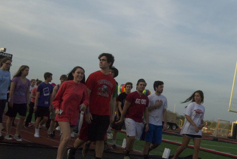 Students take their first lap of Relay on Friday, April 11, 2014.