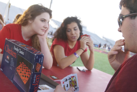 Connor Cross, Stephanie Thompson, and Rachel Segal enjoy a game of cards during Relay for Life on Friday, April 11, 2014.