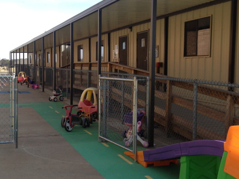 Outside of the portables is a play area with several toys and activities for the children during their free time. 
